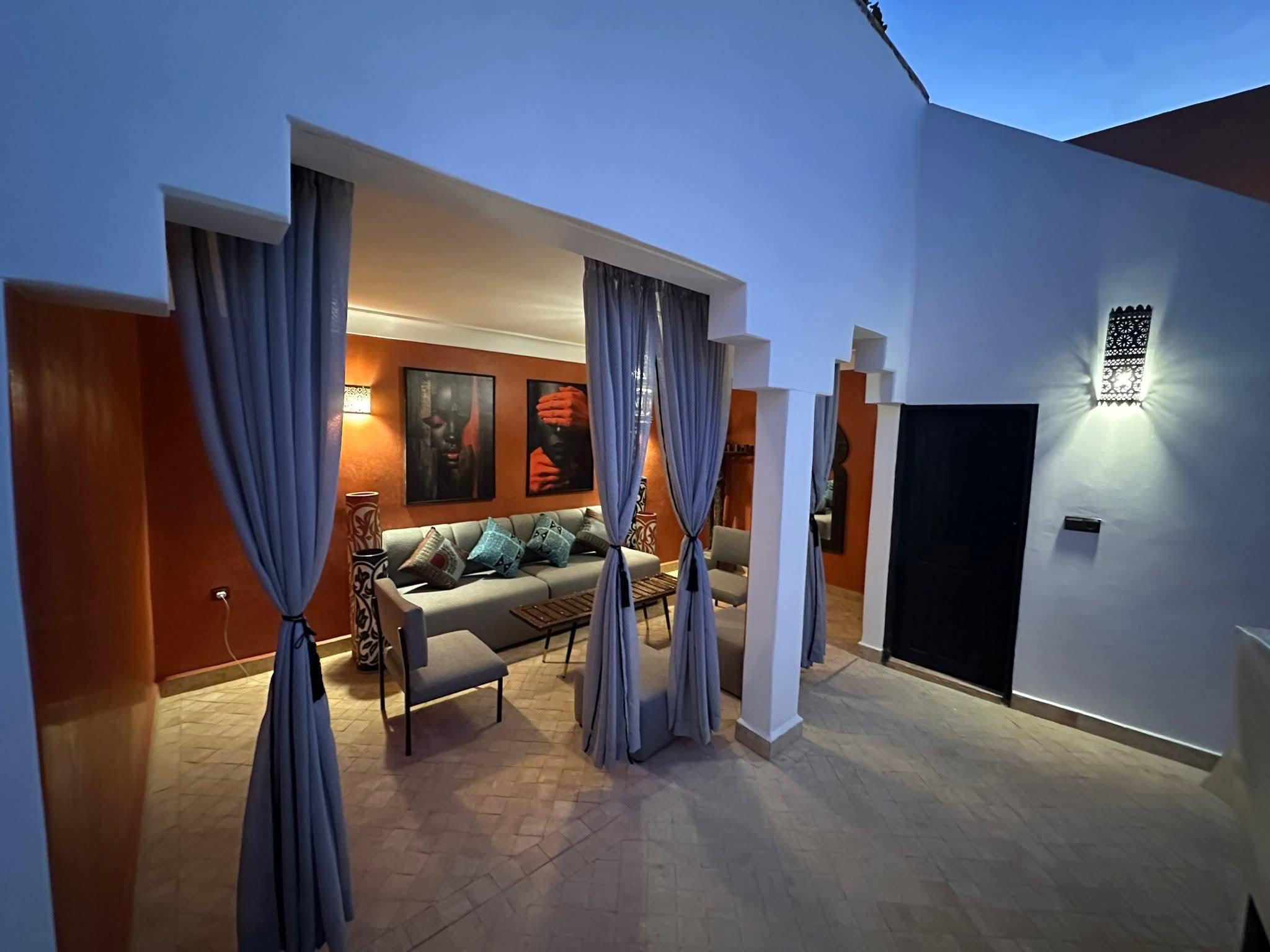 A Moroccan riad courtyard with traditional tiles and arches.
